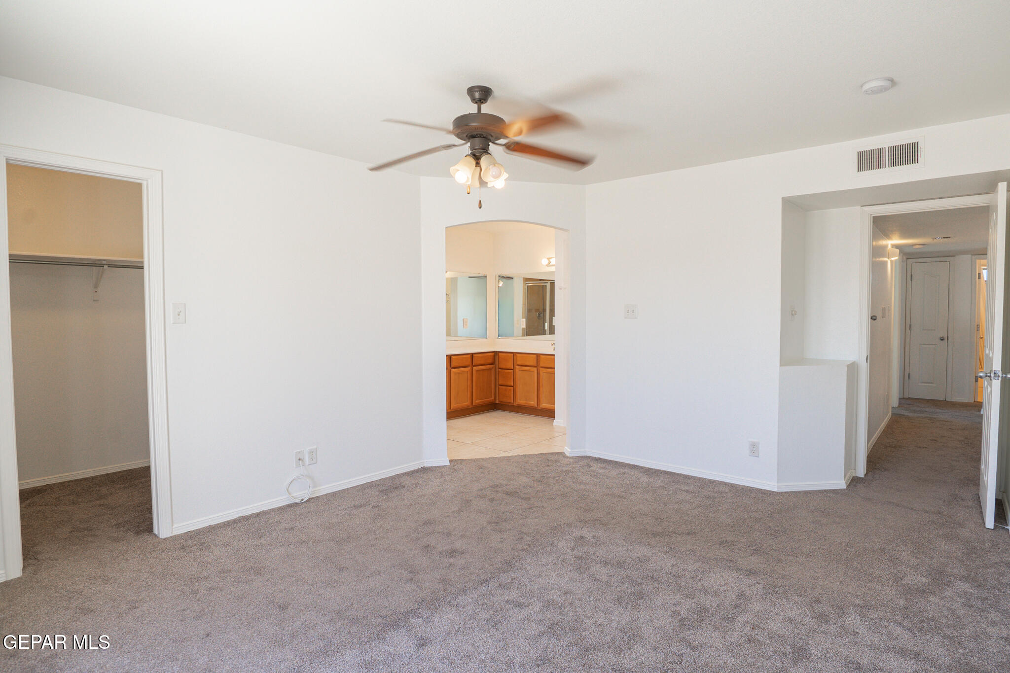 1497 Dunlin Place El Paso, TX 79928 - Photo 20 of 38 a view of a kitchen with a sink and a chandelier fan