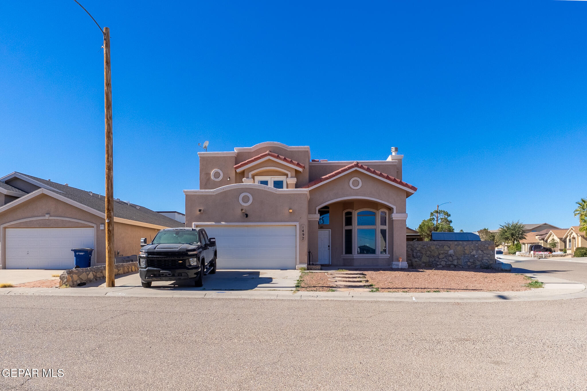 1497 Dunlin Place El Paso, TX 79928 - Photo 2 of 38 a car parked in front of a house