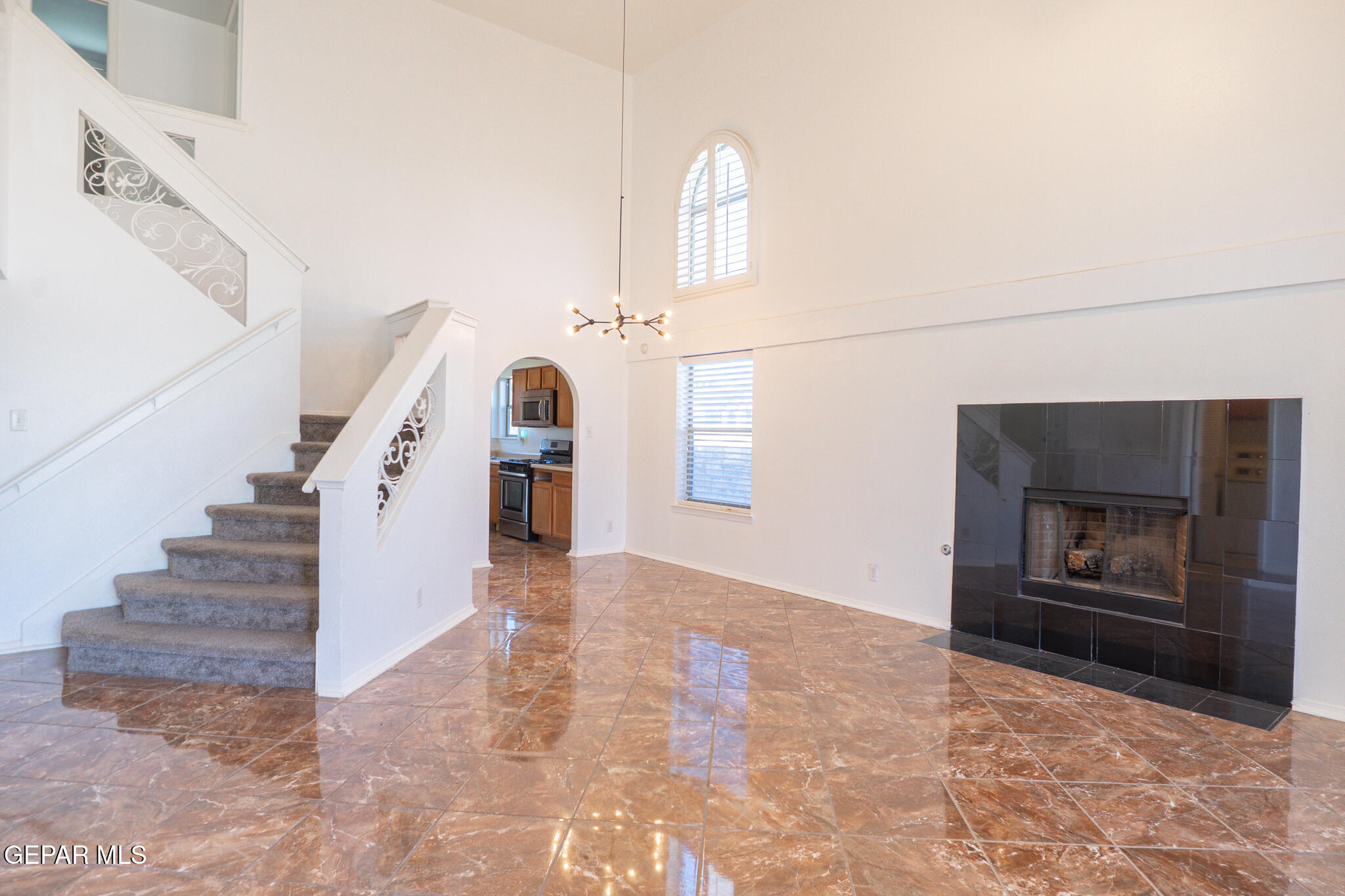 1497 Dunlin Place El Paso, TX 79928 - Photo 3 of 38 a view of entryway and hall with a fireplace