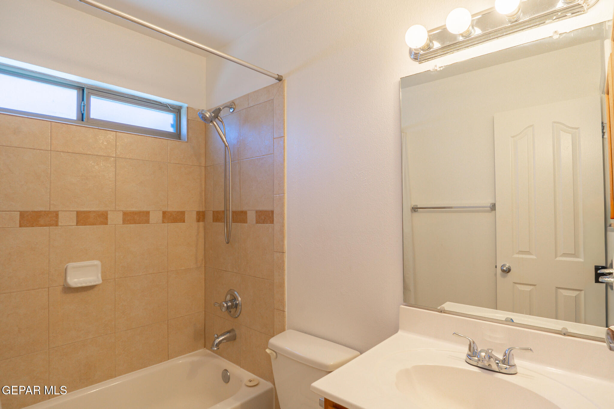 1497 Dunlin Place El Paso, TX 79928 - Photo 31 of 38 a bathroom with a sink mirror vanity and toilet