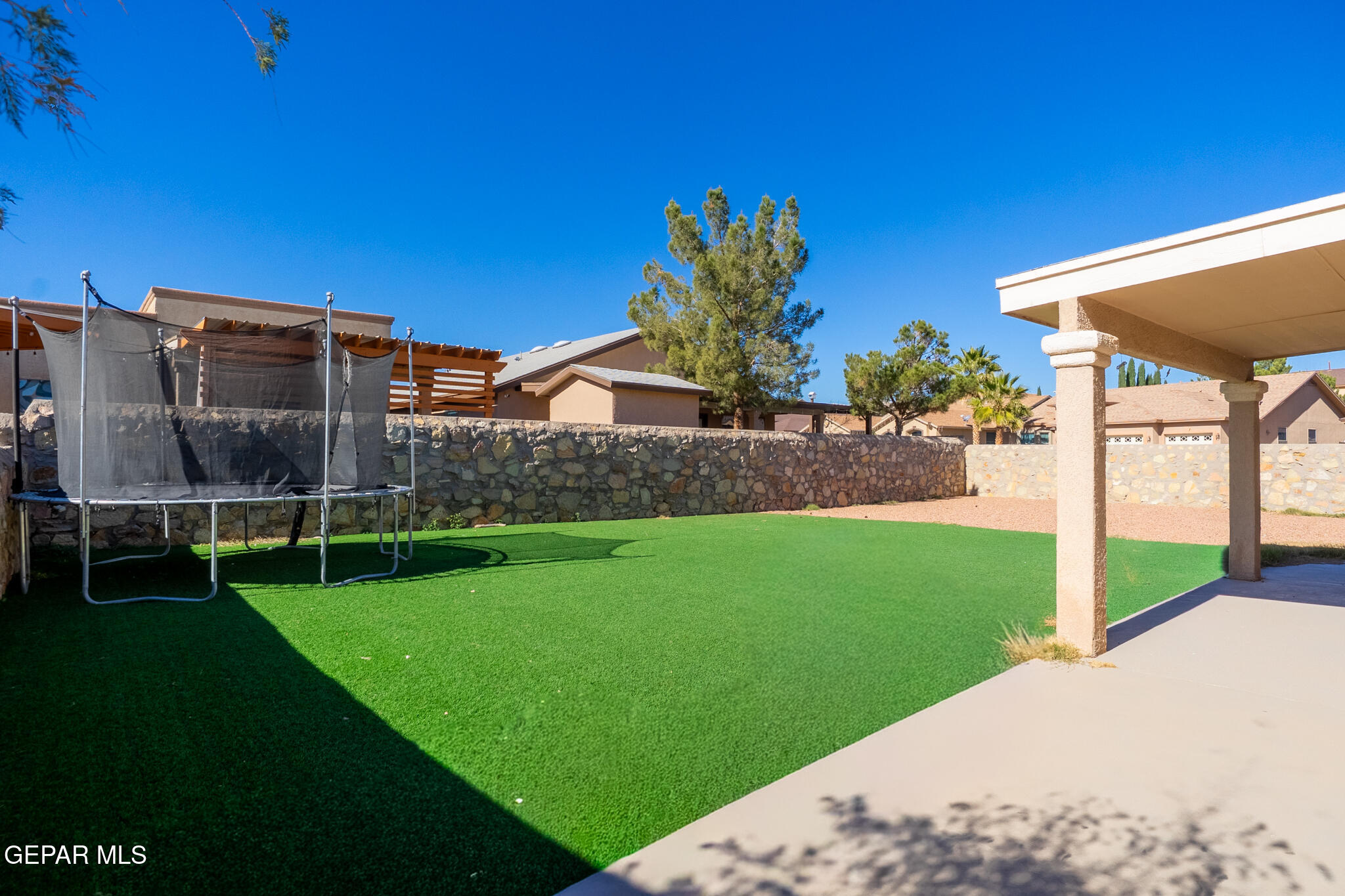 1497 Dunlin Place El Paso, TX 79928 - Photo 35 of 38 a view of a backyard with a garden