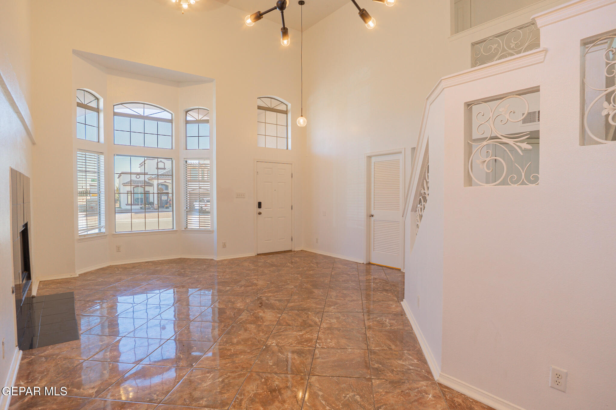 1497 Dunlin Place El Paso, TX 79928 - Photo 6 of 38 a view of an empty room with windows