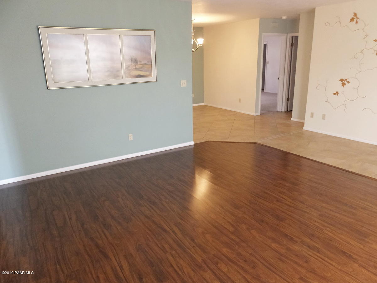 11950 Rawhide Ridge Dewey, AZ 86327 - Photo 5 of 37 a view of an empty room with wooden floor