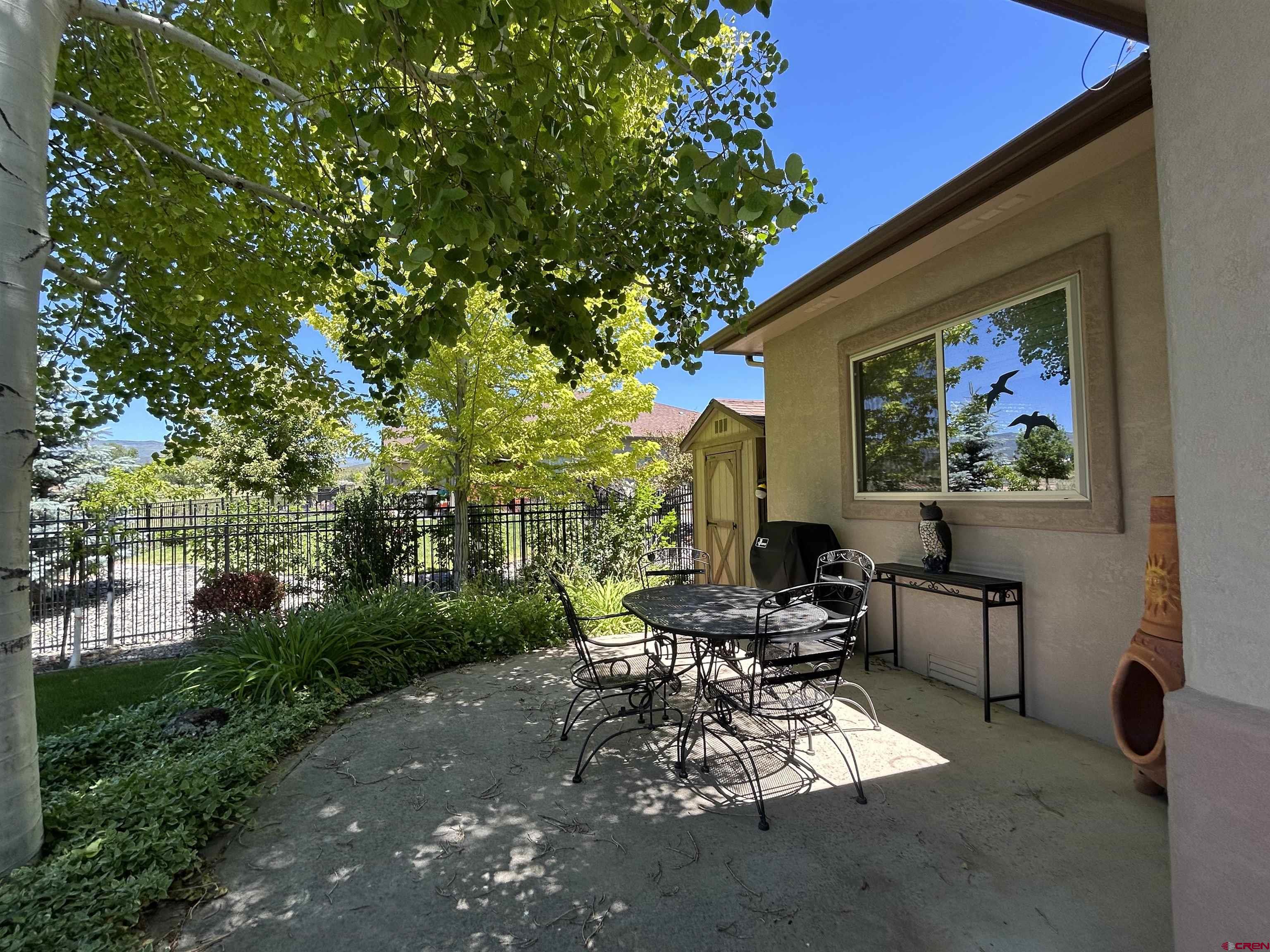 850 Southeast Pinyon Street Cedaredge, CO 81413 - Photo 30 of 45 a view of a patio with chairs and potted plants