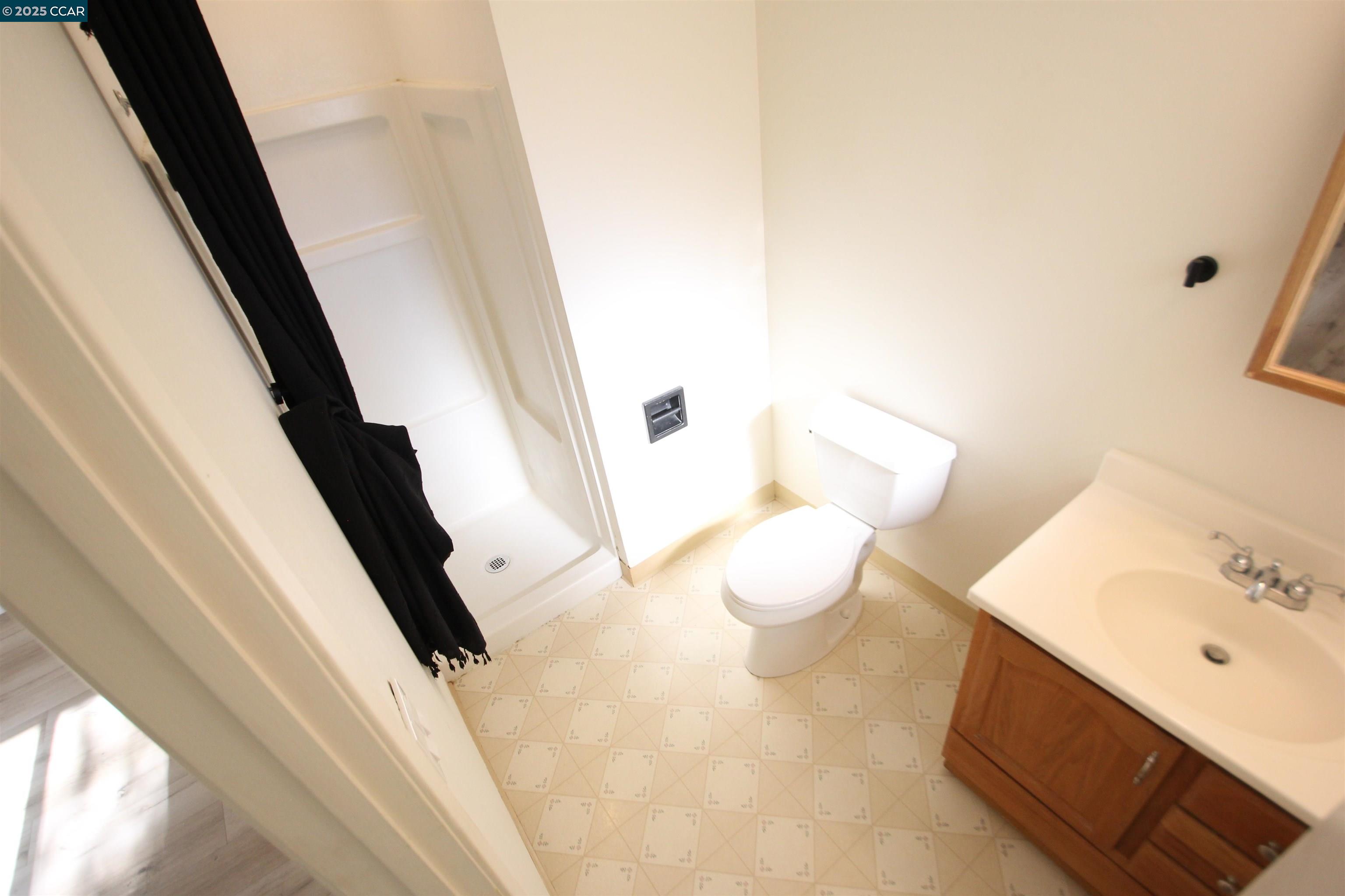 10 School Street Isleton, CA 95641 - Photo 13 of 23 a bathroom with a sink and a mirror