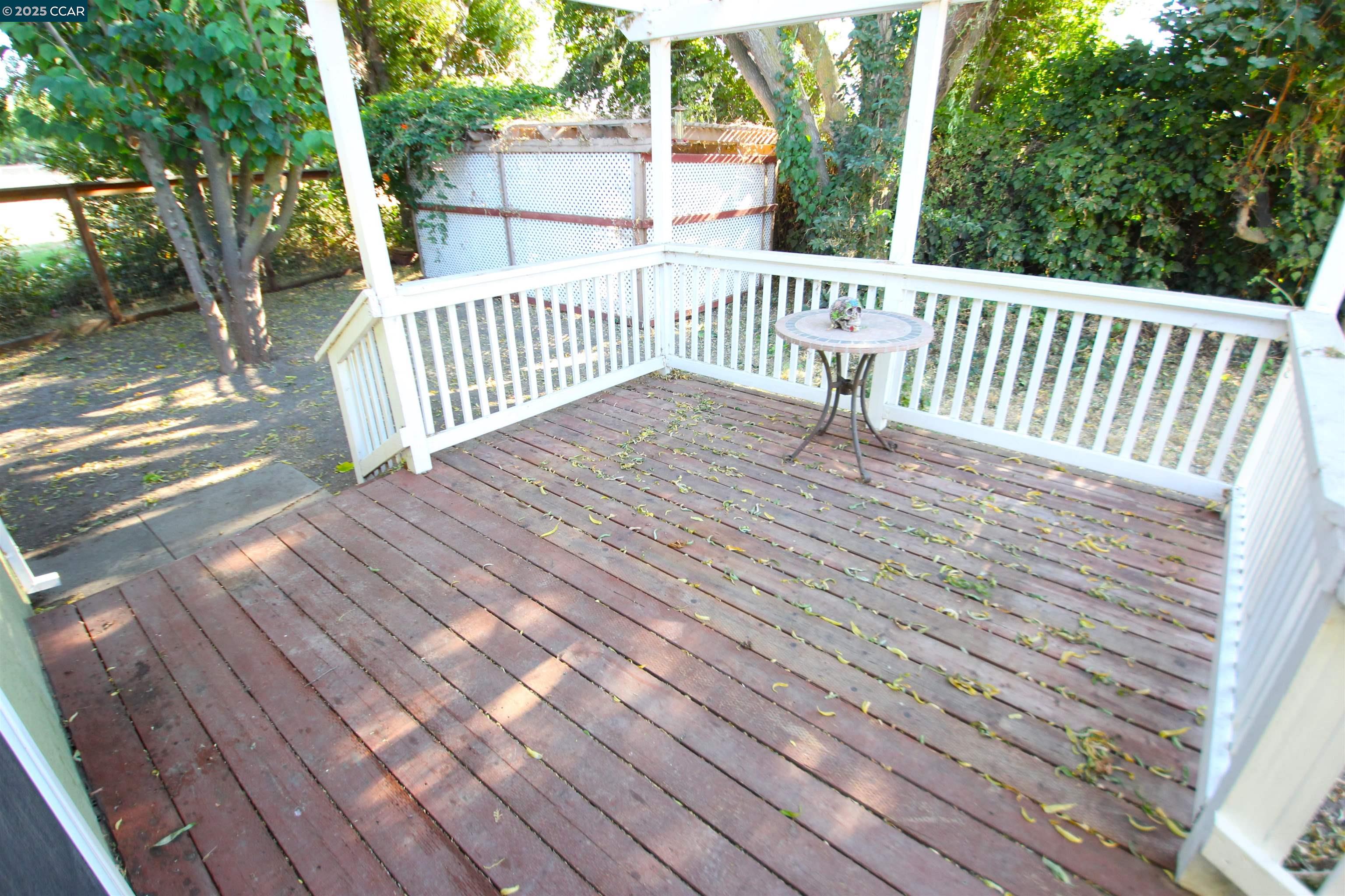 10 School Street Isleton, CA 95641 - Photo 14 of 23 a view of deck with wooden floor and outdoor seating