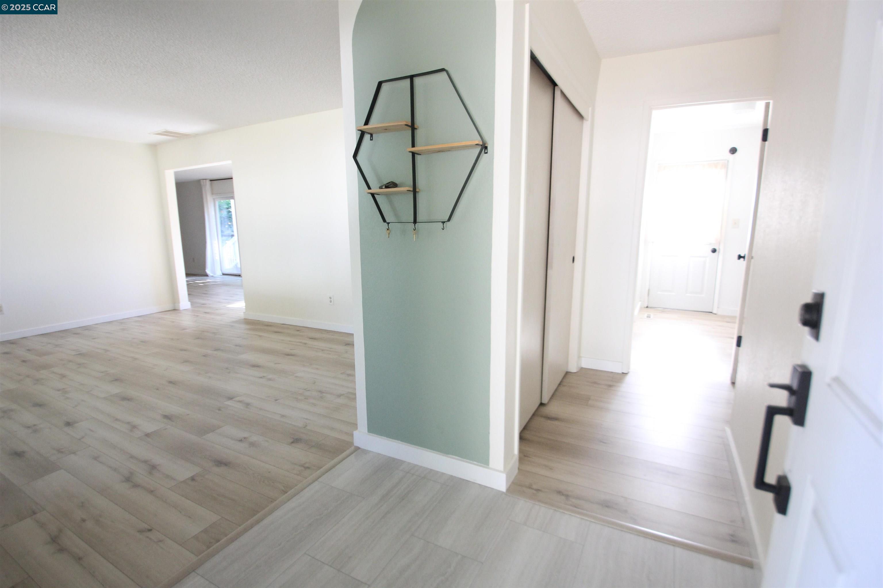 10 School Street Isleton, CA 95641 - Photo 3 of 23 wooden floor with view of bathroom