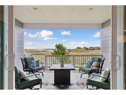 a view of a balcony with lake view and mountain view