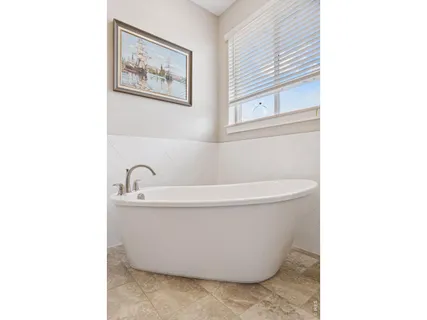 a white bath tub sitting in a bathroom