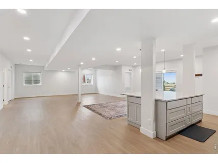 a view of kitchen and wooden floor