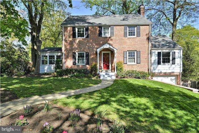 9503 St Andrews Way Silver Spring, MD 20901 - Photo 1 of 30 a front view of a house with a yard and porch
