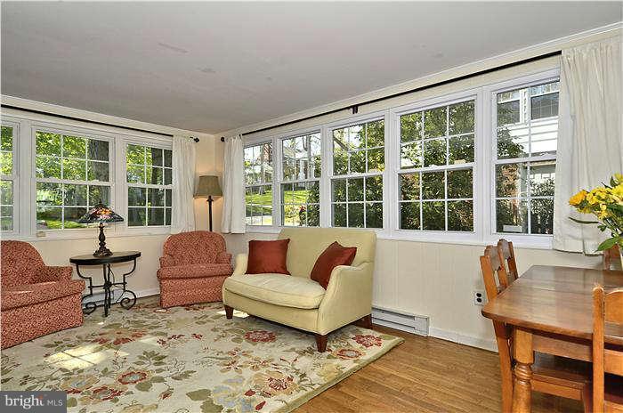 9503 St Andrews Way Silver Spring, MD 20901 - Photo 11 of 30 a living room with furniture and a large window