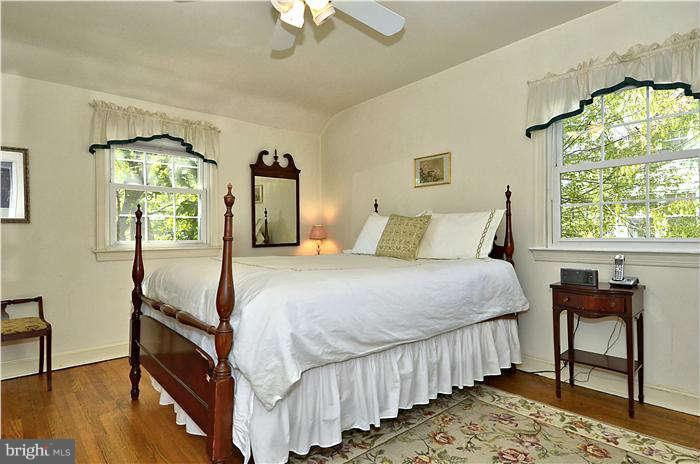 9503 St Andrews Way Silver Spring, MD 20901 - Photo 18 of 30 a bedroom with a bed and a window