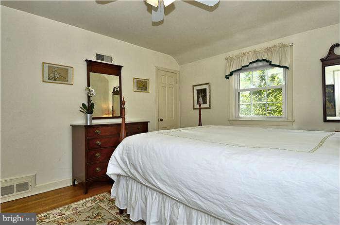 9503 St Andrews Way Silver Spring, MD 20901 - Photo 19 of 30 a bedroom with a bed and a window