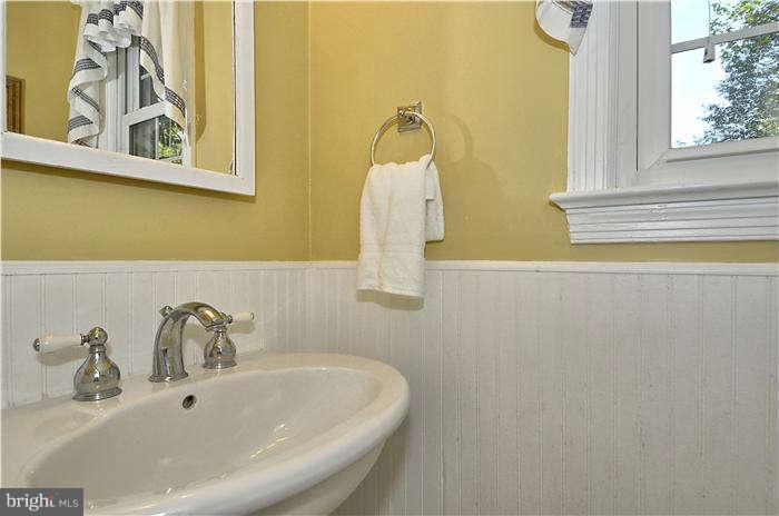 9503 St Andrews Way Silver Spring, MD 20901 - Photo 23 of 30 a bathroom with a sink and a window