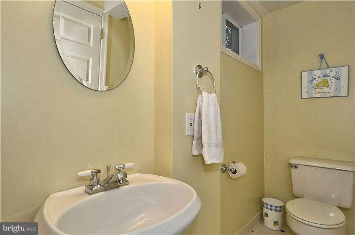 9503 St Andrews Way Silver Spring, MD 20901 - Photo 26 of 30 a bathroom with a sink and a mirror