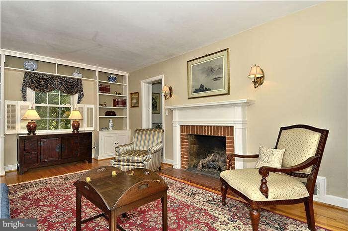 9503 St Andrews Way Silver Spring, MD 20901 - Photo 6 of 30 a living room with furniture and a fireplace