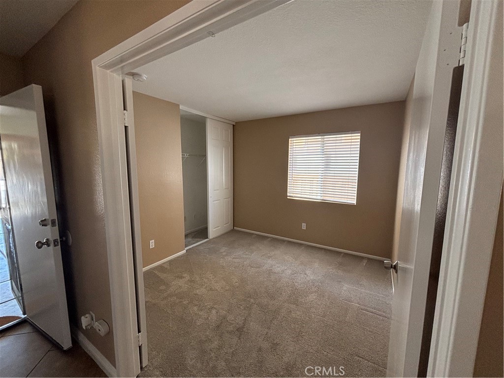 43545 Corte Logrono Temecula, CA 92592 - Photo 13 of 49 an empty room with windows and closet