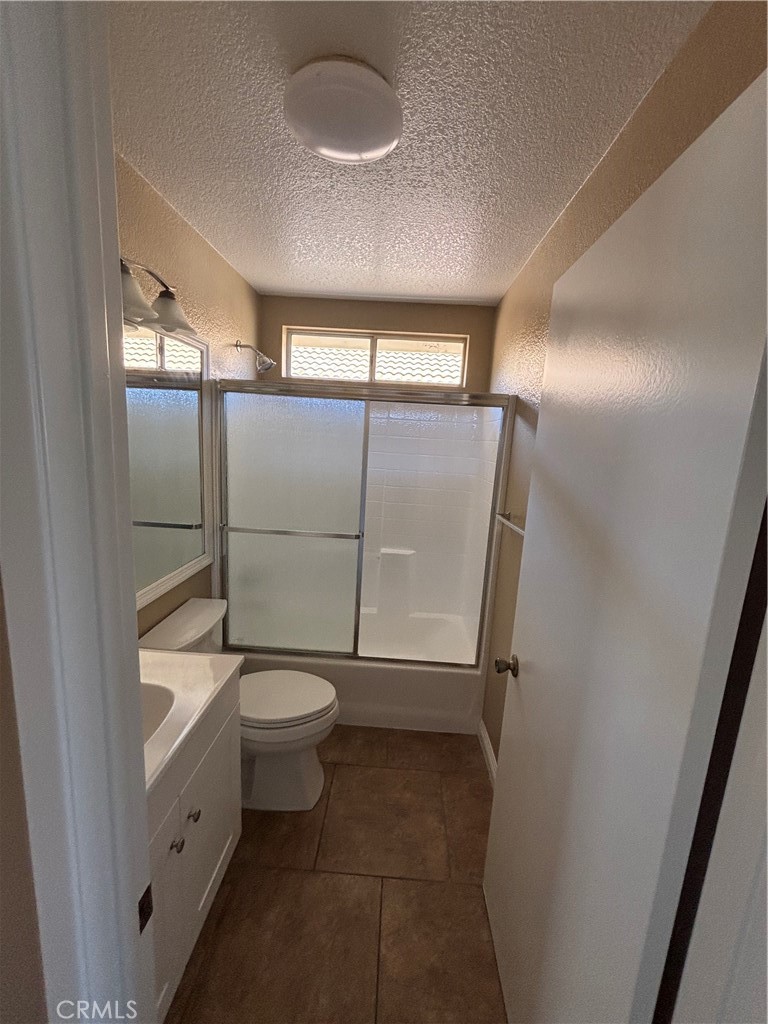 43545 Corte Logrono Temecula, CA 92592 - Photo 14 of 49 a bathroom with a toilet sink and mirror