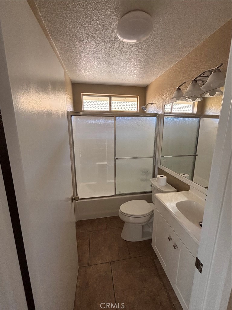 43545 Corte Logrono Temecula, CA 92592 - Photo 17 of 49 a white toilet sitting next to a bathroom sink