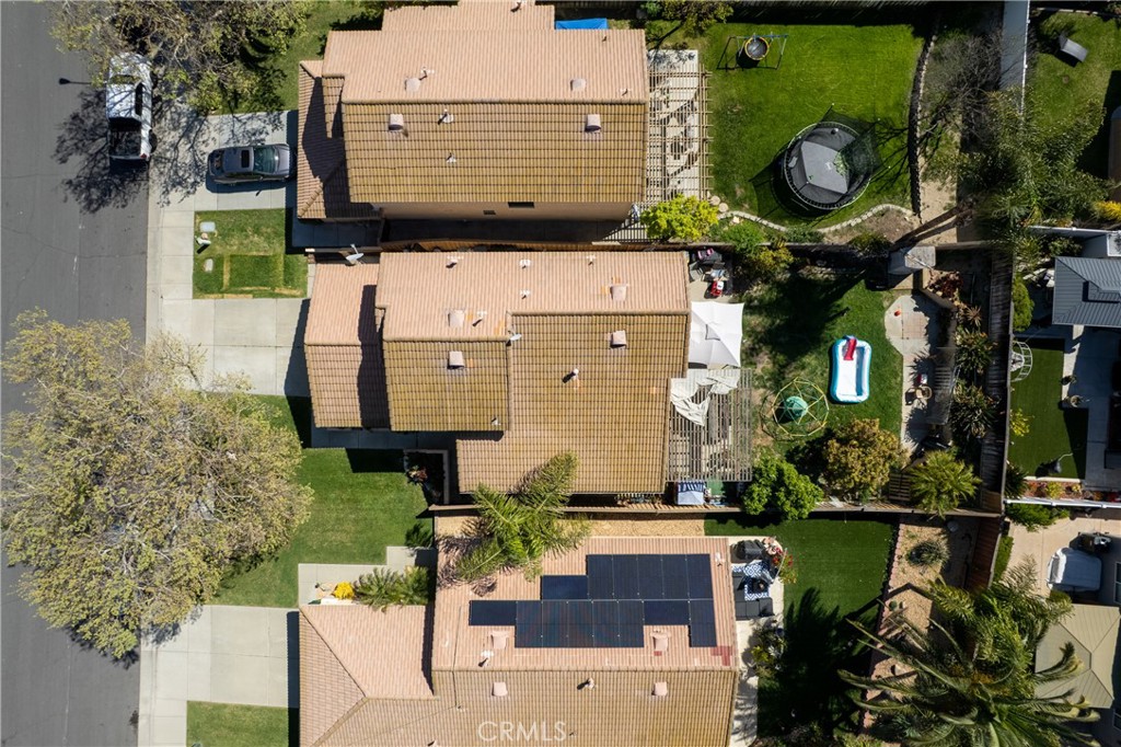 43545 Corte Logrono Temecula, CA 92592 - Photo 39 of 49 a view of a chairs and table in a backyard