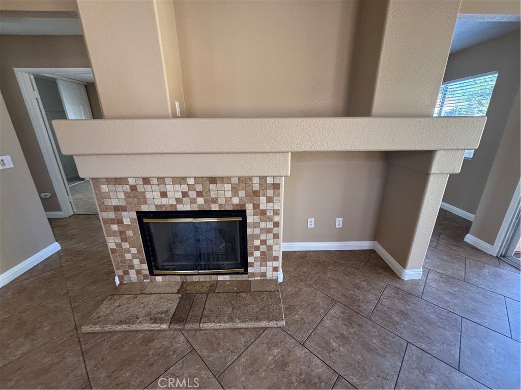 43545 Corte Logrono Temecula, CA 92592 - Photo 6 of 49 a living room with a fireplace