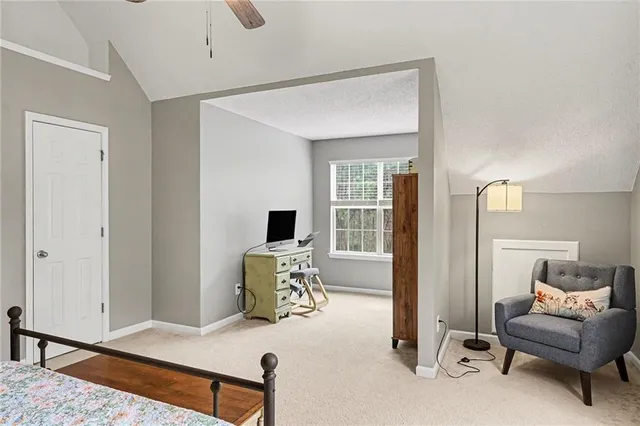 a bedroom with furniture and a window