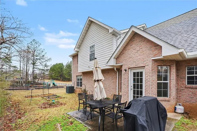 a view of a yard with patio