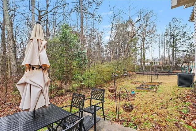 a view of yard with patio