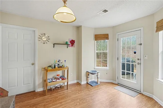 a bedroom with furniture and a window