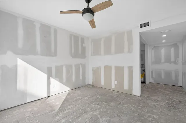 a view of an empty room with a window