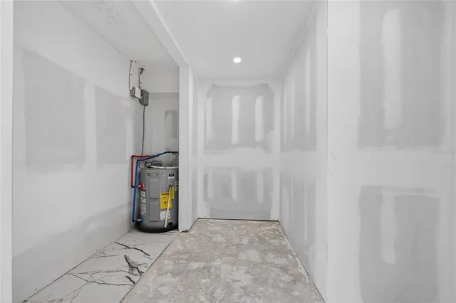 a bathroom with a toilet a sink and a mirror