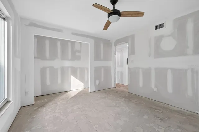 a view of a hallway with a bathroom and a sink