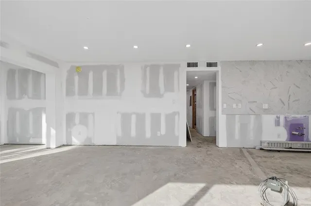 a kitchen with stainless steel appliances granite countertop a sink and a stove