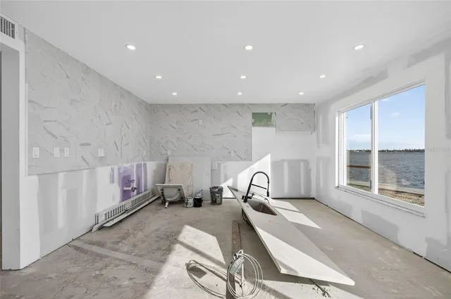 an empty room with fireplace