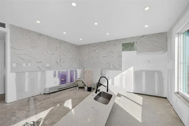 an aerial view of a house with a garden space