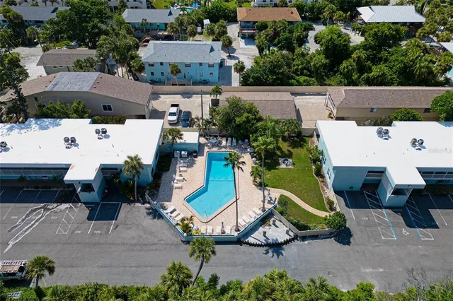 an aerial view of houses with outdoor space