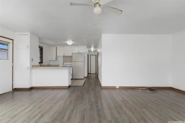 a view of kitchen with wooden floor and window