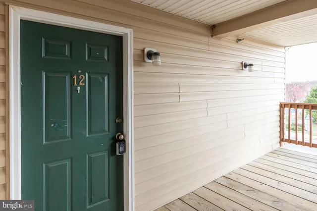 a view of a wooden door and a window