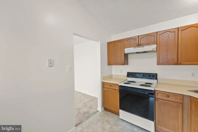 a kitchen with a stove and a microwave