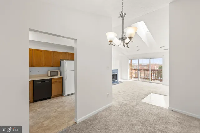 a view of a kitchen with a dishwasher cabinets and a kitchen counter top space