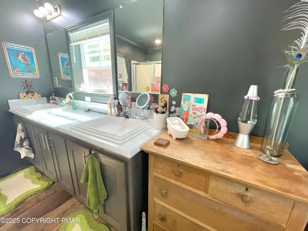 a kitchen with sink and a mirror