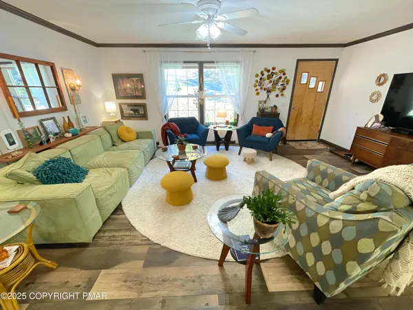 a kitchen with stainless steel appliances granite countertop a table chairs sink and cabinets