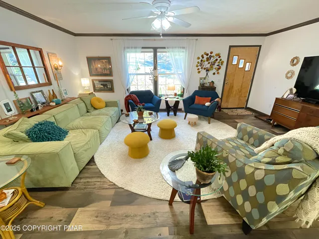 a kitchen with stainless steel appliances granite countertop a table chairs sink and cabinets