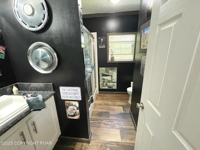 a white toilet sitting next to a window