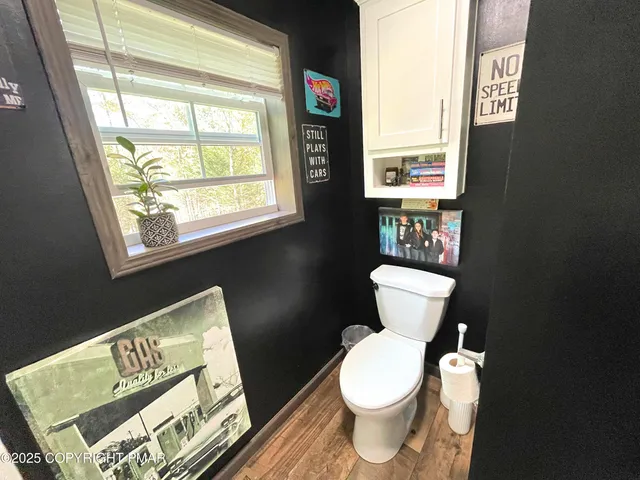 a bathroom with a sink mirror and vanity