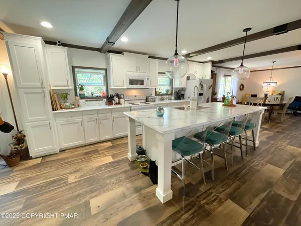 a kitchen with stainless steel appliances granite countertop a stove and refrigerator