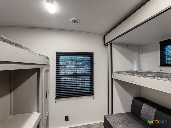 a view of a kitchen from the hallway