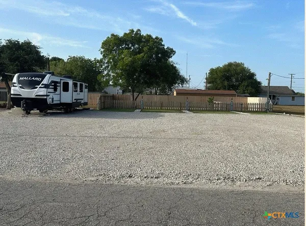 a house with trees in the background