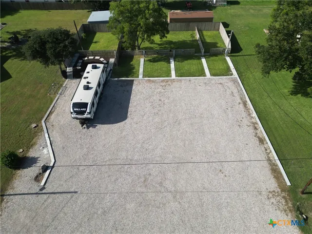 a view of backyard with swimming pool